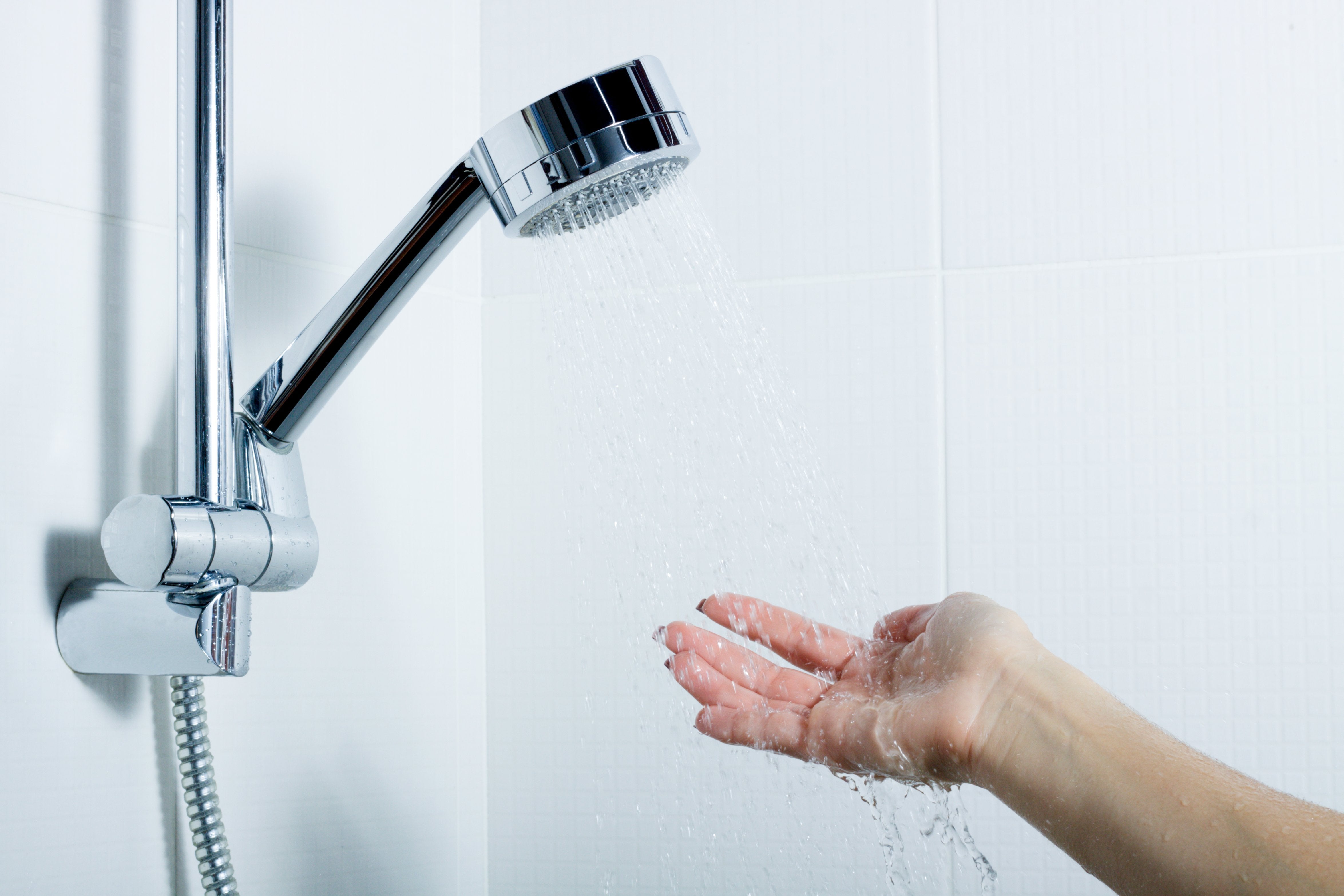 running water from a rail shower head