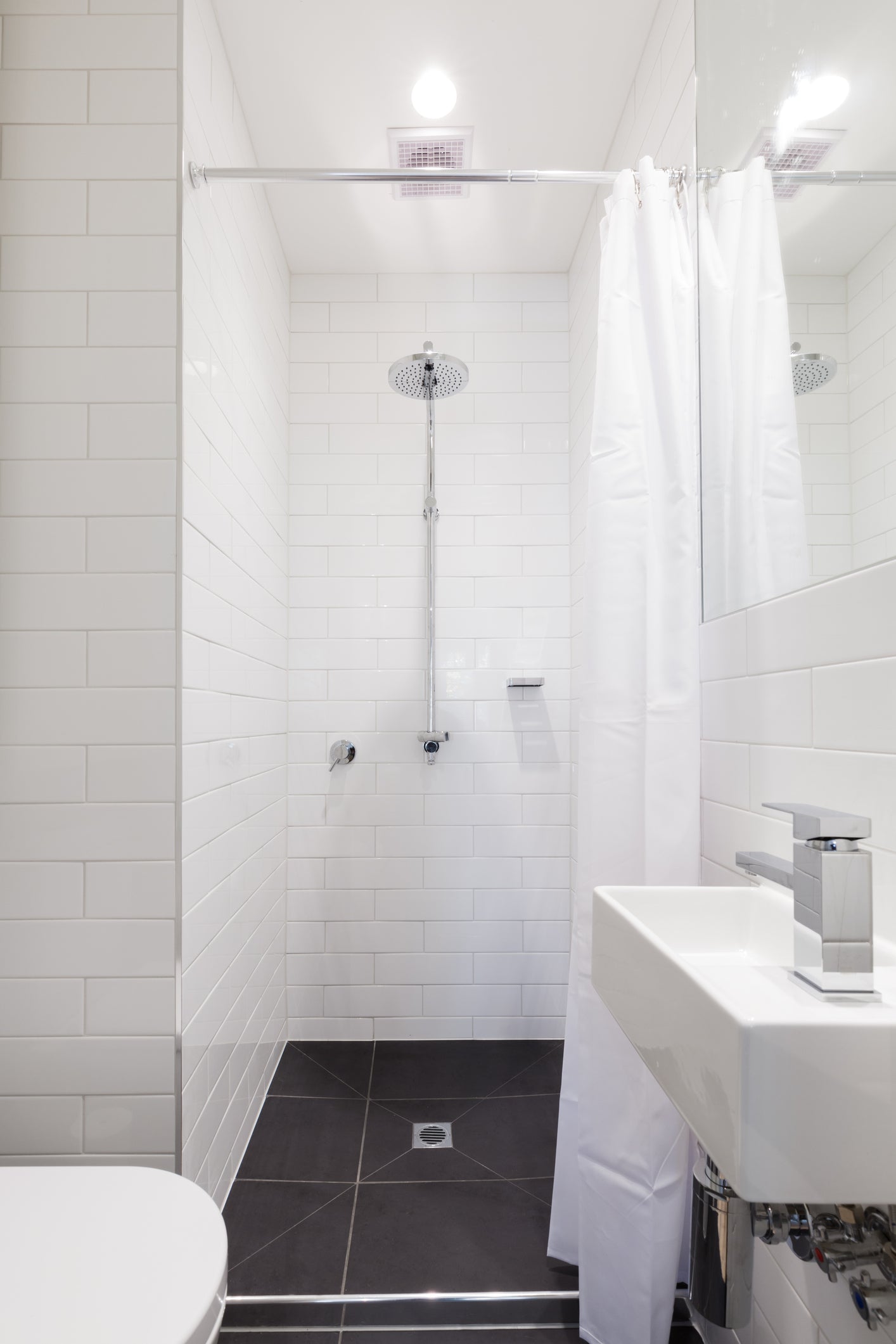 bathroom shower with tiled shower bases