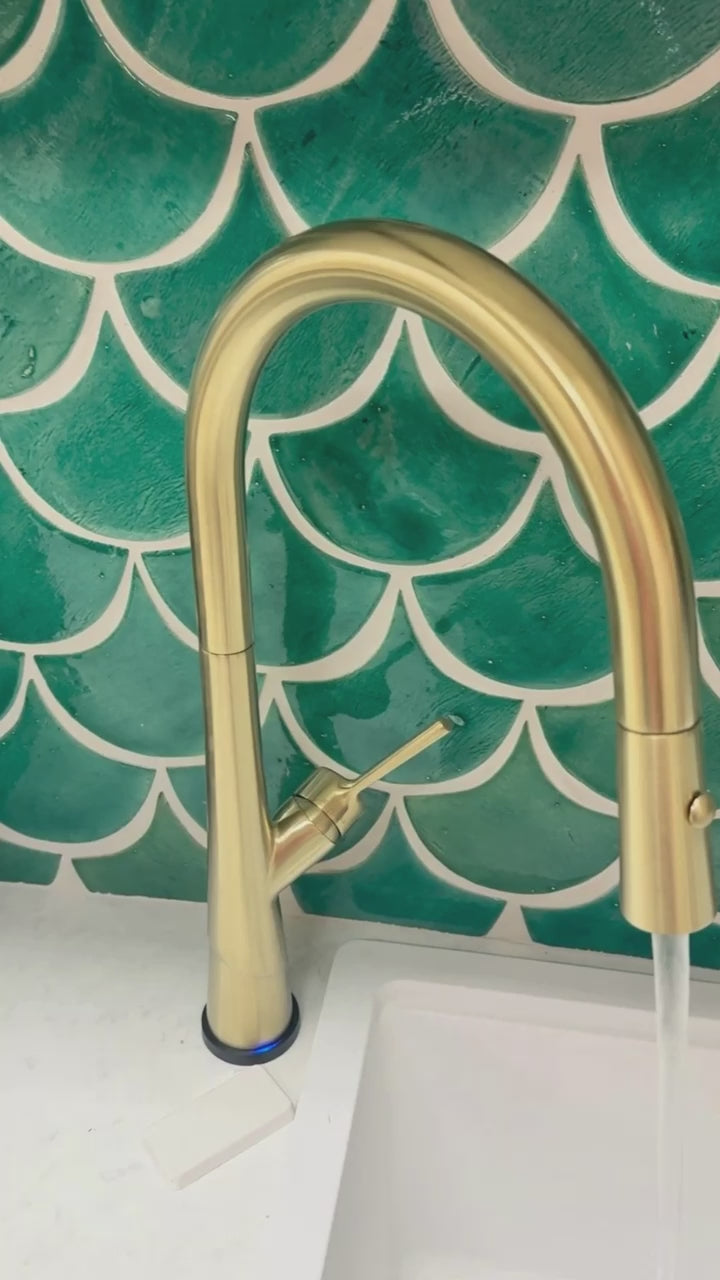 This brushed brass sink mixer turns on and off with a touch. This video shows how it functions.